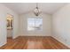 Main bedroom with hardwood floors and a view of the backyard at 9488 Brook Ln, Lone Tree, CO 80124