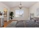 Main bedroom with hardwood floors, large window, and ensuite bathroom at 9488 Brook Ln, Lone Tree, CO 80124