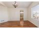 Main bedroom with hardwood floors and access to the bathroom at 9488 Brook Ln, Lone Tree, CO 80124