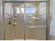 Shower stall with tiled walls and a glass door at 9488 Brook Ln, Lone Tree, CO 80124