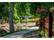 Scenic community park featuring a stream, walking path, and a playground in the distance at 10938 Mcclellan Rd, Parker, CO 80134