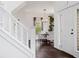 Bright dining room featuring a round table, chandelier, and view through the double doors at 10938 Mcclellan Rd, Parker, CO 80134