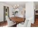 Open concept dining room featuring a round table, view of the staircase and access to the kitchen at 10938 Mcclellan Rd, Parker, CO 80134