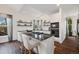 Modern kitchen island featuring sleek countertops, a gas cooktop, and barstool seating at 10938 Mcclellan Rd, Parker, CO 80134