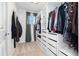 Well-organized walk-in closet with custom shelving, drawers, and hanging rods, providing ample storage space at 10938 Mcclellan Rd, Parker, CO 80134