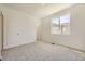 Inviting bedroom with plush carpeting and a sunlit window at 2002 S Haleyville Way, Aurora, CO 80018