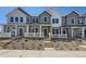 Charming townhome with covered porch, professional landscaping, and inviting curb appeal at 2002 S Haleyville Way, Aurora, CO 80018