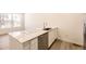 Stylish kitchen island featuring a stainless steel dishwasher and undermount sink at 2002 S Haleyville Way, Aurora, CO 80018