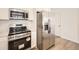 Well-equipped kitchen featuring stainless steel appliances and ample counter space at 2002 S Haleyville Way, Aurora, CO 80018