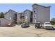 Apartment building showing balconies, stairways, and parking spots at 2575 S Syracuse Way # H106, Denver, CO 80231