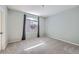 Neutral bedroom with a large window and plush carpeting at 2575 S Syracuse Way # H106, Denver, CO 80231