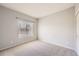 Well-lit bedroom with a view of the outside at 2575 S Syracuse Way # H106, Denver, CO 80231