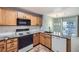 Bright kitchen with granite counters, stainless steel appliances, and adjacent dining area at 2575 S Syracuse Way # H106, Denver, CO 80231