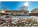 Fenced backyard with patio, swing set and partial view of house at 1331 4Th St, Fort Lupton, CO 80621