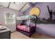 Bunk beds in a bedroom with purple walls at 1331 4Th St, Fort Lupton, CO 80621