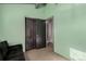 Bedroom with sofa bed and light green walls at 1331 4Th St, Fort Lupton, CO 80621