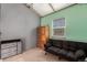 Bedroom with sofa bed and gray walls at 1331 4Th St, Fort Lupton, CO 80621