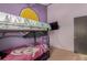 Bedroom with bunk beds and purple walls at 1331 4Th St, Fort Lupton, CO 80621