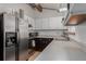 Galley kitchen with stainless steel appliances at 1331 4Th St, Fort Lupton, CO 80621