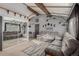 Open living room with gray sectional sofa and mirrored closet at 1331 4Th St, Fort Lupton, CO 80621