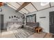 Bright living room with gray sectional sofa and wood accent beams at 1331 4Th St, Fort Lupton, CO 80621