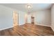 Bright bedroom featuring hardwood floors and ample closet space at 16700 Alzere Pl, Parker, CO 80134