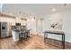 Open concept kitchen featuring an island and hardwood floors at 16700 Alzere Pl, Parker, CO 80134