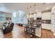 Modern kitchen with white cabinets, granite countertops, and stainless steel appliances at 16700 Alzere Pl, Parker, CO 80134