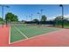 Well-maintained tennis court with green surface at 16700 Alzere Pl, Parker, CO 80134