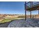 Stone patio with fenced yard, providing the perfect space for outdoor gatherings and relaxation at 6646 Merrimack Dr, Castle Pines, CO 80108