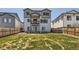 A manicured backyard that is fenced in, and includes a lovely green lawn at 6646 Merrimack Dr, Castle Pines, CO 80108