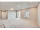 Finished basement with large sliding glass door and natural light at 6646 Merrimack Dr, Castle Pines, CO 80108