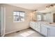 Bright bathroom with a dual sink vanity, shower and lots of natural light at 6646 Merrimack Dr, Castle Pines, CO 80108