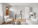 Inviting living room featuring hardwood floors, neutral walls, and stylish decor at 4182 W Quinn Pl, Denver, CO 80236