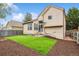 The property features a well-manicured backyard with artificial grass and an inviting outdoor living area at 21052 E 45Th Ave, Denver, CO 80249