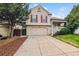 Charming two-story home with a well-manicured lawn, two car garage, and lovely curb appeal at 21052 E 45Th Ave, Denver, CO 80249