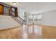 Bright and airy living room featuring a staircase, hardwood floors, and plenty of natural light at 21052 E 45Th Ave, Denver, CO 80249