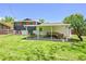 Cozy covered patio with seating area and lush green lawn, great for outdoor entertaining at 1173 Xenon St, Golden, CO 80401