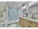 Charming bathroom featuring a double sink vanity and a walk-in shower at 1173 Xenon St, Golden, CO 80401
