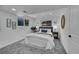 Cozy bedroom features soft gray carpet and ample natural light from two windows at 1173 Xenon St, Golden, CO 80401