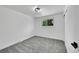 Empty bedroom with gray carpet, a window and closet at 1173 Xenon St, Golden, CO 80401