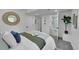 Bright bedroom boasts a neutral palette and a bathroom en suite at 1173 Xenon St, Golden, CO 80401