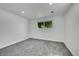 Empty bedroom with grey carpet and natural lighting at 1173 Xenon St, Golden, CO 80401