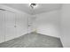 Empty bedroom with gray carpet, a window, and closet at 1173 Xenon St, Golden, CO 80401