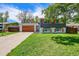 Well-maintained home with a vibrant lawn, modern garage door, and inviting curb appeal at 1173 Xenon St, Golden, CO 80401