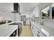 Contemporary kitchen with white subway tile backsplash, stainless steel appliances, and lots of white cabinets at 1173 Xenon St, Golden, CO 80401