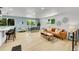 Bright living space with light wood floors, modern furnishings, and a stylish leather sofa with decorative pillows at 1173 Xenon St, Golden, CO 80401