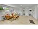 Comfortable living room featuring a leather sofa, wood floors, and modern decor leading to hallway and bedrooms at 1173 Xenon St, Golden, CO 80401