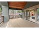 Balcony with wood plank flooring and views of evergreen trees at 11406 Conifer Ridge Dr, Conifer, CO 80433