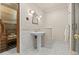 Modern bathroom featuring a sauna, pedestal sink, and glass shower at 11406 Conifer Ridge Dr, Conifer, CO 80433